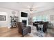Spacious living room with a fireplace, ceiling fan, and hardwood floors at 3026 Towne Mill Ave, Canton, GA 30114