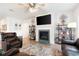 Comfortable living room showcasing a fireplace, ceiling fan, and stylish furnishings at 3026 Towne Mill Ave, Canton, GA 30114