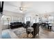 Open concept living room flows into the kitchen and dining area, with comfortable leather seating at 3026 Towne Mill Ave, Canton, GA 30114