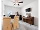 Home office featuring a desk, piano, ceiling fan, and neutral carpeting at 3026 Towne Mill Ave, Canton, GA 30114