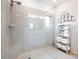Tiled shower space featuring built-in seat, handheld showerhead, and glass door at 3026 Towne Mill Ave, Canton, GA 30114