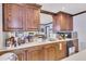 Wet bar with custom wood cabinets, countertops, and mirrored backsplash for a unique touch at 407 Amber Ln, Woodstock, GA 30189