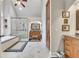 This bathroom features a glass shower, garden tub, cabinetry, vaulted ceiling, and stylish decor at 407 Amber Ln, Woodstock, GA 30189