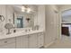 Clean bathroom with a spacious vanity, modern fixtures, and view of bedroom at 407 Amber Ln, Woodstock, GA 30189
