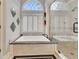 This bathroom features a garden tub, shower, and a large window with lots of natural light at 407 Amber Ln, Woodstock, GA 30189