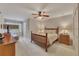 This bedroom features a ceiling fan, a bed, and lots of natural light at 407 Amber Ln, Woodstock, GA 30189