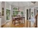 Breakfast nook with hardwood floors, lots of windows, chandelier and easy access to kitchen at 407 Amber Ln, Woodstock, GA 30189