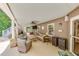 Covered patio with a ceiling fan and a TV, creating an outdoor living space at 407 Amber Ln, Woodstock, GA 30189