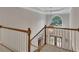 This entryway features tall ceilings, hardwood flooring, and lots of natural light at 407 Amber Ln, Woodstock, GA 30189