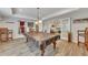 Game room with billiard table, seating, neutral walls, and access to the living area at 407 Amber Ln, Woodstock, GA 30189