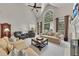 Open living room with fireplace and built-ins, soaring ceilings and lots of natural light at 407 Amber Ln, Woodstock, GA 30189