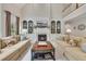 Spacious living room with high ceilings, fireplace with built-ins, and neutral-toned furnishings at 407 Amber Ln, Woodstock, GA 30189