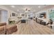 Bright living room offering ample seating, recessed lights, and a television for enjoyment at 407 Amber Ln, Woodstock, GA 30189