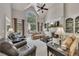 Open living room with fireplace and built-ins, soaring ceilings and many windows at 407 Amber Ln, Woodstock, GA 30189
