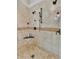 This shower features multiple shower heads and tiled walls at 407 Amber Ln, Woodstock, GA 30189