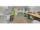Studio with functional sewing tables, colorful decor, and room for hobbies and crafts at 407 Amber Ln, Woodstock, GA 30189