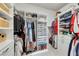 This walk-in closet is large and features custom shelving for storage and organization at 407 Amber Ln, Woodstock, GA 30189