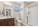 Bathroom featuring a glass enclosed shower, tile floors, a toilet, and vanity with mirror and overhead lighting at 532 Lemon Ne St, Marietta, GA 30060
