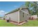 House exterior with neutral siding and brick foundation, surrounded by a well-maintained yard at 532 Lemon Ne St, Marietta, GA 30060