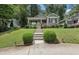 Charming gray home with landscaped front yard and inviting front porch with manicured bushes lining the walkway at 532 Lemon Ne St, Marietta, GA 30060