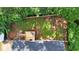 Aerial view of the property highlighting the fenced backyard, wooden deck, and surrounding mature trees at 6918 Heritage Pl, Acworth, GA 30102