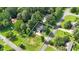 An aerial view of a single-Gathering home with large, well-maintained yard and mature trees in established neighborhood at 6918 Heritage Pl, Acworth, GA 30102
