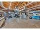 Spacious basement with utilities, kayaks, ATV, and lawn care equipment storage at 6918 Heritage Pl, Acworth, GA 30102