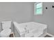 Bright bathroom with a large soaking tub, tile floors, a modern toilet and a window at 6918 Heritage Pl, Acworth, GA 30102
