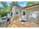 Wooden deck with built-in outdoor kitchen, perfect for entertaining at 6918 Heritage Pl, Acworth, GA 30102