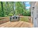 Wooden deck with built-in outdoor kitchen, perfect for entertaining at 6918 Heritage Pl, Acworth, GA 30102