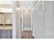 Hallway with wood floors, white doors and white trim at 6918 Heritage Pl, Acworth, GA 30102