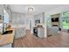 Bright, modern kitchen features light blue cabinets, wood countertops, and stainless appliances at 6918 Heritage Pl, Acworth, GA 30102