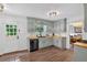 Inviting kitchen featuring light blue cabinets, wood countertops, and stainless steel dishwasher at 6918 Heritage Pl, Acworth, GA 30102