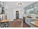 Updated kitchen featuring stainless appliances, wood-look floors, stylish cabinets, and abundant natural light at 6918 Heritage Pl, Acworth, GA 30102