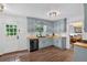 Updated kitchen with butcher block countertops, stylish blue cabinetry, and stainless steel appliances at 6918 Heritage Pl, Acworth, GA 30102