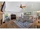 Inviting living room with vaulted ceilings, a stone fireplace, and lots of natural light at 6918 Heritage Pl, Acworth, GA 30102