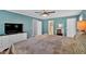 Large main bedroom with ensuite bathroom, hardwood floors, a sitting area and a TV at 6918 Heritage Pl, Acworth, GA 30102