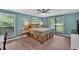 Spacious main bedroom with hardwood floors, neutral walls and lots of natural light at 6918 Heritage Pl, Acworth, GA 30102