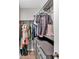 Organized walk-in closet with hanging racks, shelving, and drawers for ample storage at 6918 Heritage Pl, Acworth, GA 30102