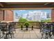 Outdoor patio with wrought-iron furniture and downtown views, perfect for relaxing or entertaining at 77 Peachtree Ne Pl # 101, Atlanta, GA 30309