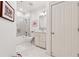 Bathroom with walk-in shower, toilet, vanity, and tile floors at 77 Peachtree Ne Pl # 101, Atlanta, GA 30309