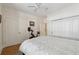 Bedroom with ceiling fan, neutral walls, wood floors, and lots of storage at 77 Peachtree Ne Pl # 101, Atlanta, GA 30309