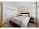 Cozy bedroom with wood floors, closet, ensuite bath, and lots of natural light at 77 Peachtree Ne Pl # 101, Atlanta, GA 30309