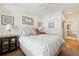 Comfortable bedroom with wood floors and ensuite bathroom featuring neutral tones and ample light at 77 Peachtree Ne Pl # 101, Atlanta, GA 30309