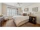 Inviting bedroom with natural light, hardwood floors, and neutral decor at 77 Peachtree Ne Pl # 101, Atlanta, GA 30309