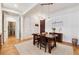 Dining room with hardwood floors, a wood table and chairs, and white trim, offering a cozy space at 77 Peachtree Ne Pl # 101, Atlanta, GA 30309