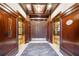 Elevator lobby featuring wood trim, tile floors, elevators with gold doors, and recessed lighting at 77 Peachtree Ne Pl # 101, Atlanta, GA 30309