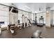 Well-equipped gym offering various exercise machines and large windows for a bright workout space at 77 Peachtree Ne Pl # 101, Atlanta, GA 30309