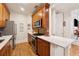 Beautiful kitchen with stainless steel appliances, white countertops, and rich wood cabinetry at 77 Peachtree Ne Pl # 101, Atlanta, GA 30309