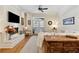 Bright and airy living room boasts hardwood floors, a fireplace, and a balcony at 77 Peachtree Ne Pl # 101, Atlanta, GA 30309